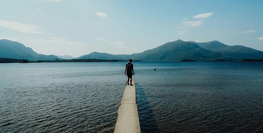 An image of a man in Killarney National Park, with Tomies Mountain in the background.