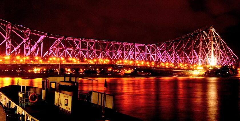 Kolkata travel guide showcases the iconic landmark Howrah Bridge.