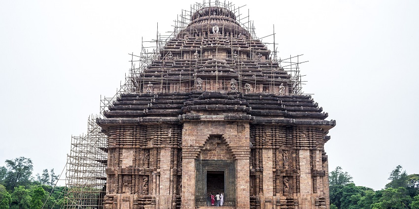 The intricately carved stone wheel of the Sun Chariot at the Konark Sun Temple, as suggested in the Odisha travel guide.