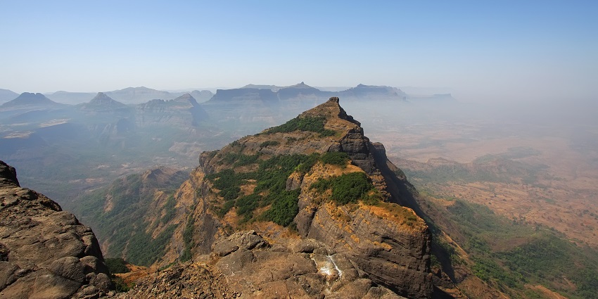 A stunning view of Konkan Kada from Harishchandragad trekking summit.