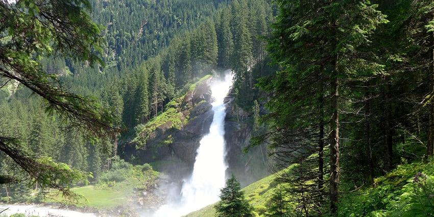 Majestic Krimml Waterfalls surrounded by nature’s serenity.