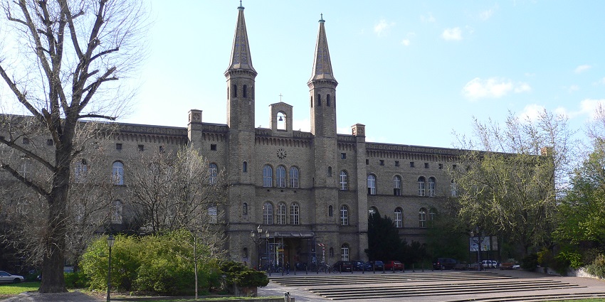 Künstlerhaus Bethanien complex area and its huge structure with cars parked outside