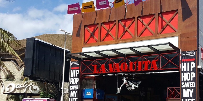 La Vaquita nightclub attraction featuring vibrant decor and an animated twerking display.