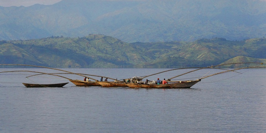 A group of fishing boats with extended fishing nets in Lake Kivu, Rwanda.