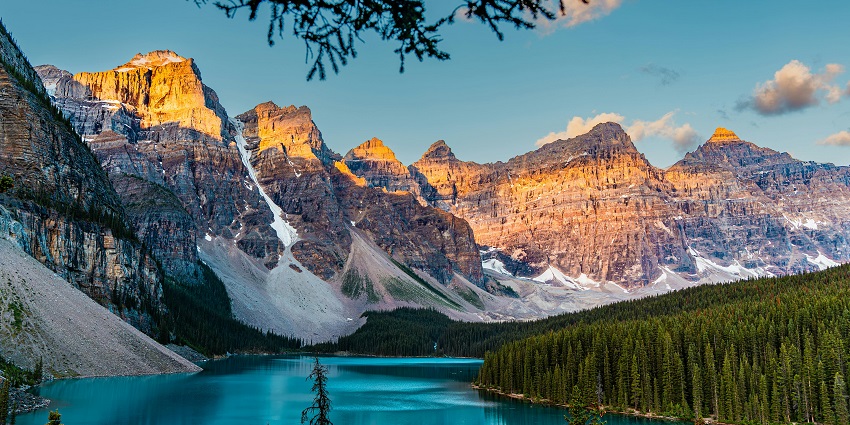 Image of a child kayaking in Lake Louise, one of the best places for Kayaking in Canada.