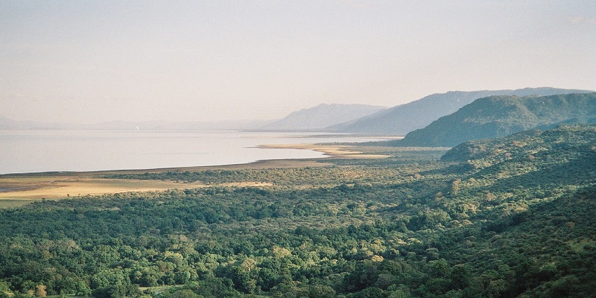 Lake Manyara National Park with hills covered in greenery and vast Manyara lake.