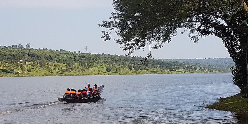 A group of tourists enjoy boating on Lake Muhazi in Eastern Province, Rwanda.
