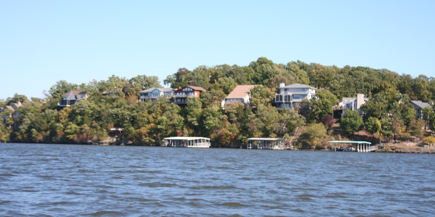 Picturesque lake, boating, fishing, hiking trails, and relaxing resorts, by Missouri travel guide.