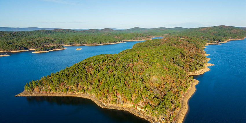 Wonderful view of Lake Ouachita State Park, featuring clearwater and surrounding trees