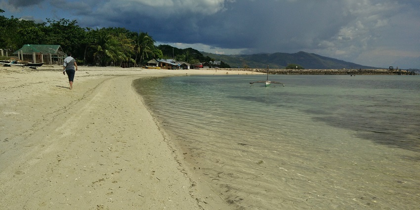 Lambug Beach offers pristine waters, white sand, and serene surroundings.