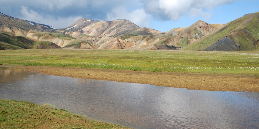 A picture of vibrant rhyolite mountains and geothermal hot springs in Landmannalaugar.