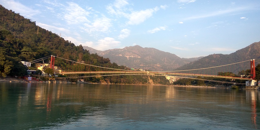 Iconic suspension bridge over Ganga River, featured in Rishikesh tour guide