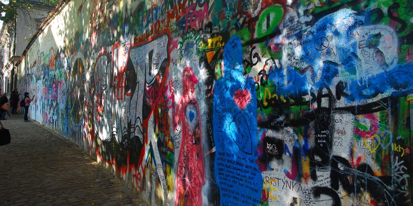 A picture of John Lennon Wall, a vibrant landmark, is a must-see among places to visit in Prague.