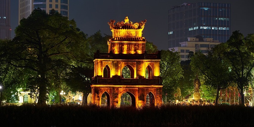 An illuminated monument in front of Hoan Kiem Lake in Hanoi, the capital of Vietnam.