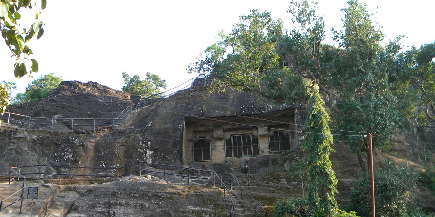 The majestic view of Pandava caves, surrounded by scenic landscapes.