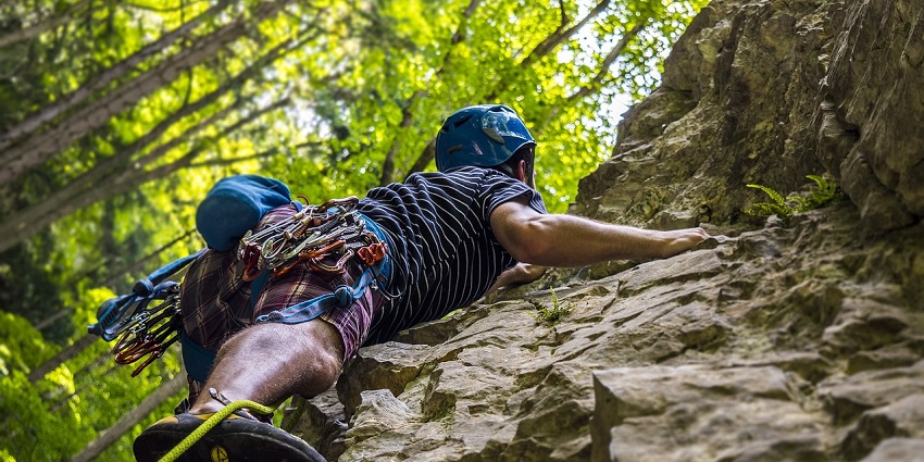 An adventurous activity, Rock Climbing, performed by a man at De Adventure Park.