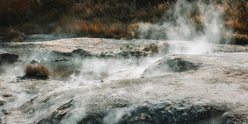 An image showing a hot, soaring stream flowing through a picturesque mountain valley.