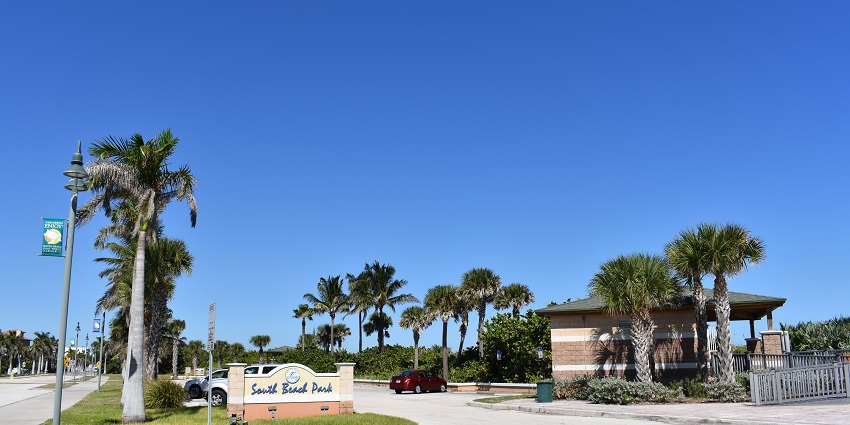 A view of the Fort Pierce sidewalk with sunset and greenery by the side in Florida.