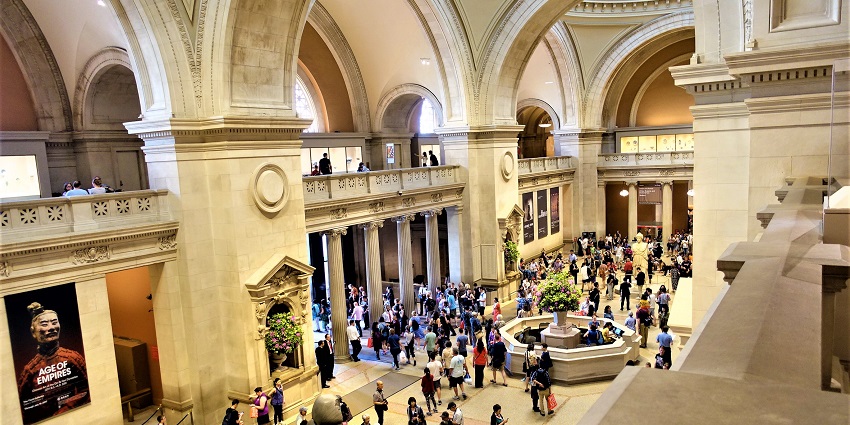 An image of the majestic entrance to the Met Museum, inviting people to see the collection.