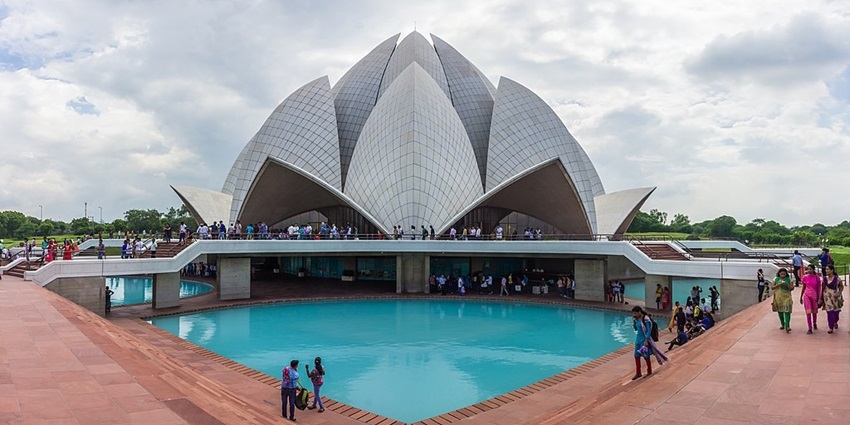 Couples sitting at a small pond at Lotus Temple in Delhi on Valentine’s Day