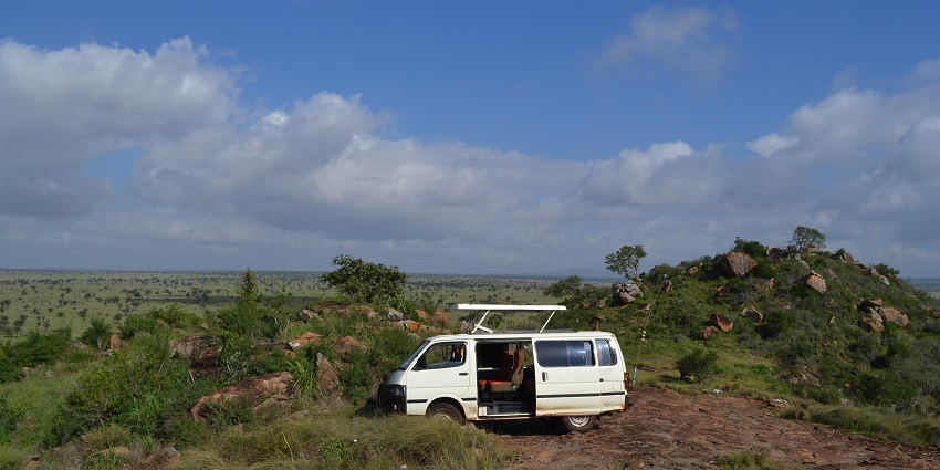 Empty game viewing vehicle parked with its roof open in Lumo Wildlife Sanctuary
