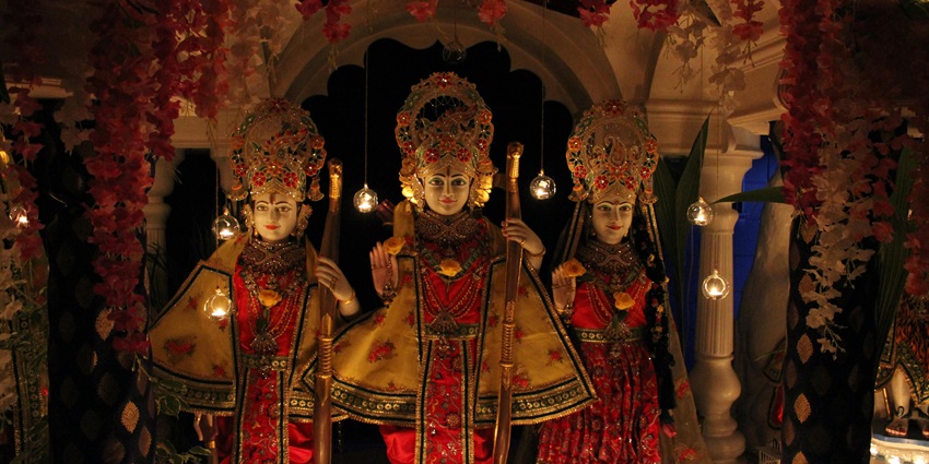 Image of Hindu Deity Statue in Gold and Red Floral Dress - Maa Sheetla Mandir