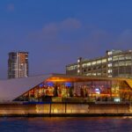 An image of nightlife in Manchester at Castlefield, showcasing its atmosphere at night.