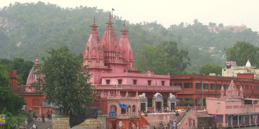 An ancient temple by the Ganga, and a view of the Mansa Devi temple on the hill above Haridwar