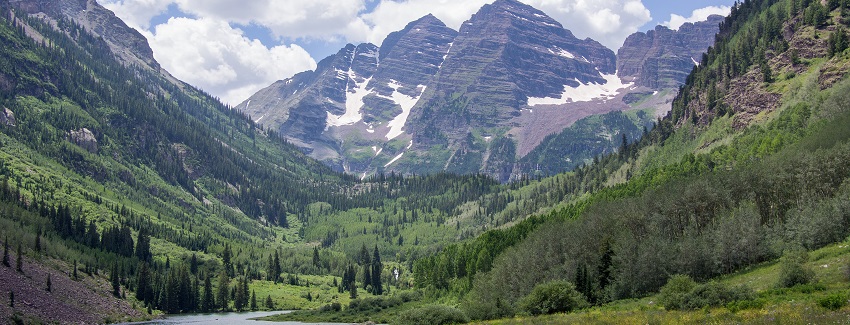 Iconic mountain peaks reflected in a serene alpine lake setting.