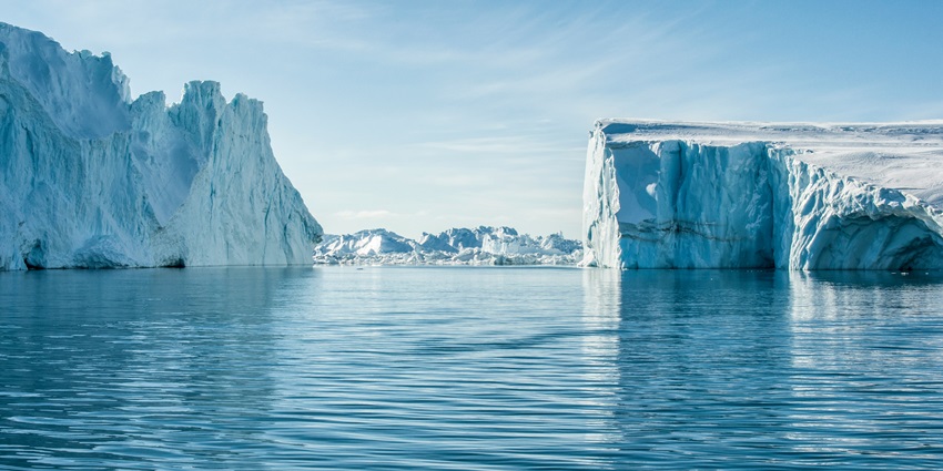 Calm waters in between two huge ice fjords in Greenland is looking heavenly in daylight.