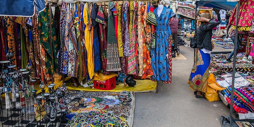 Masai people are selling colourful clothes and other accessories in the Masai Market.