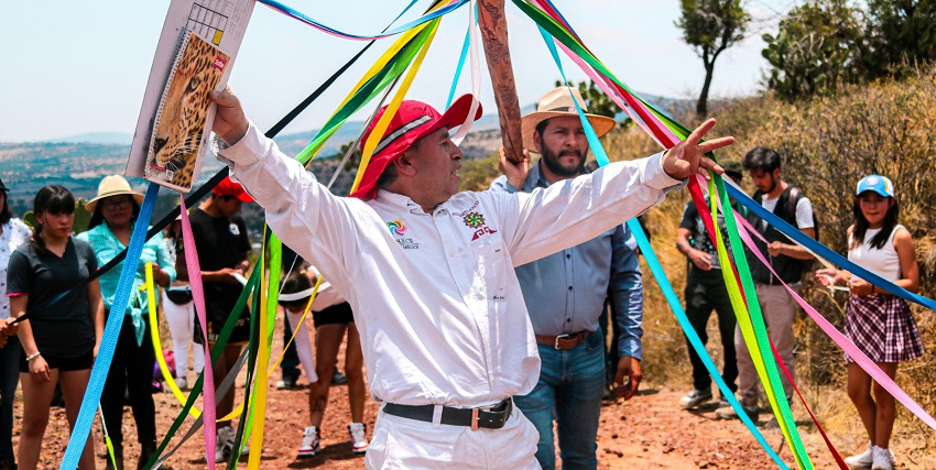 An image of the tourists maypole dancing, enjoying the may day celebrations.
