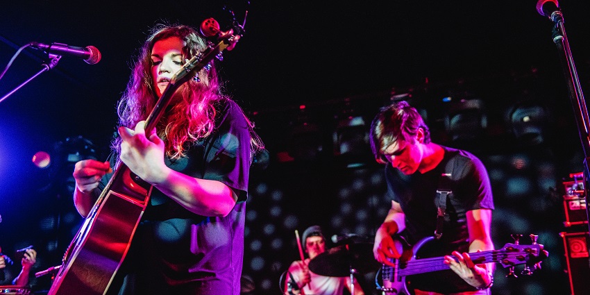 Intimate stage at Mercury Lounge, a nightlife spot for live music.