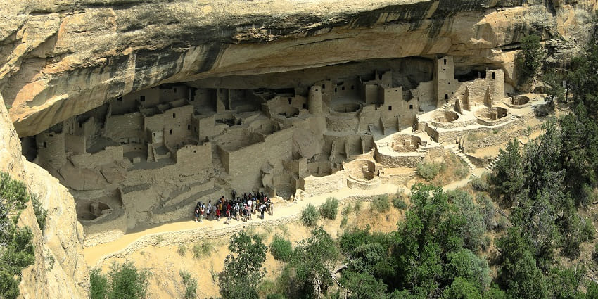 Historic park preserving ancient cliff dwellings and archaeological sites.