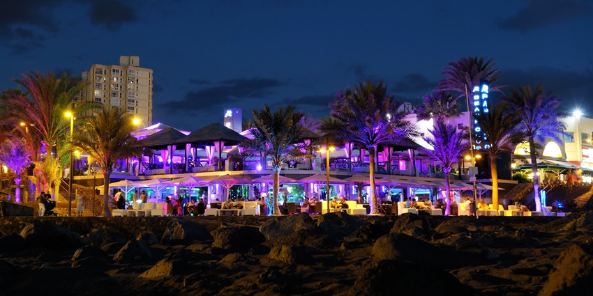 People dancing together in a lively setting, experiencing the best nightlife in America