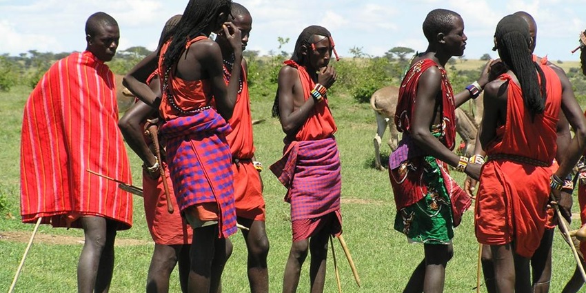 A Maasai Tribe family welcomes tourists to their village - one of the things to do in Tanzania.