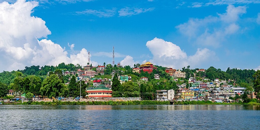 A view of a serene Mirik or Sumendu Lake - a place to visit on the Darjeeling travel guide.