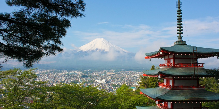 Places to visit in Japan include iconic snow-capped mountains, symbolizing Japan's serenity.
