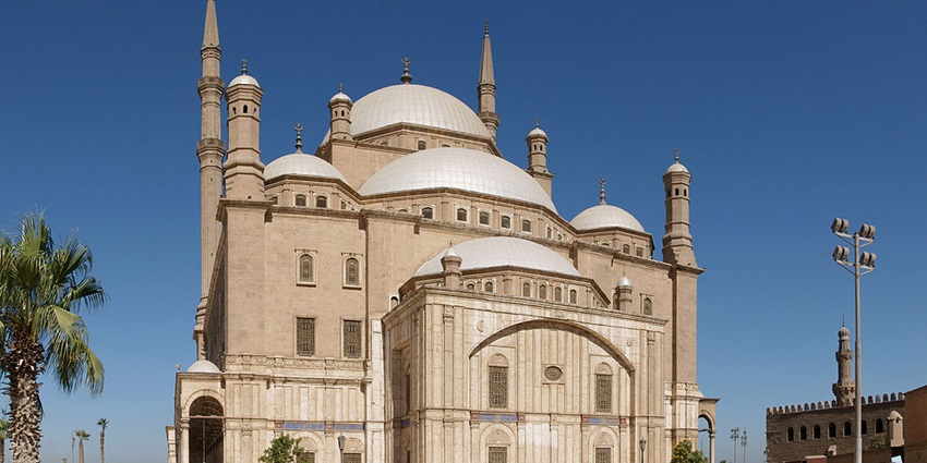 An outside view of the Muhammad Ali Mosque, in front of which many visitors are present.
