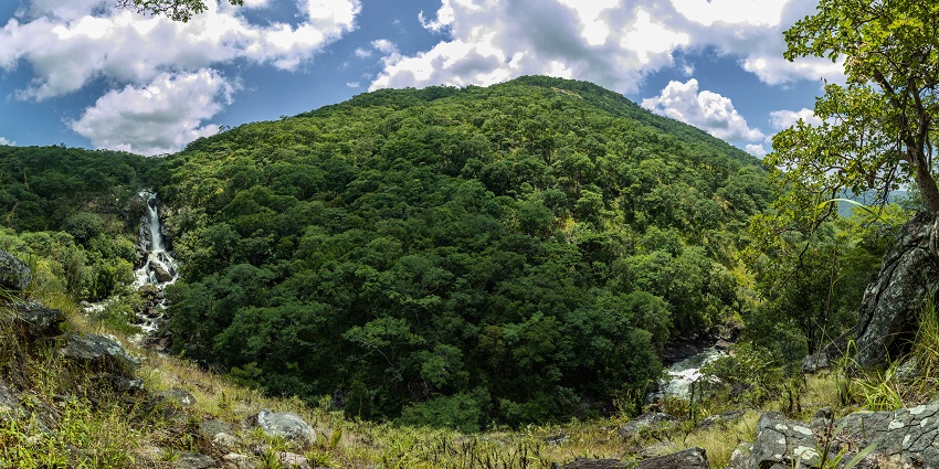 A wide view of the Mutinondo Waterfalls amid lush greenery in Mutinondo Wilderness, Ghana.