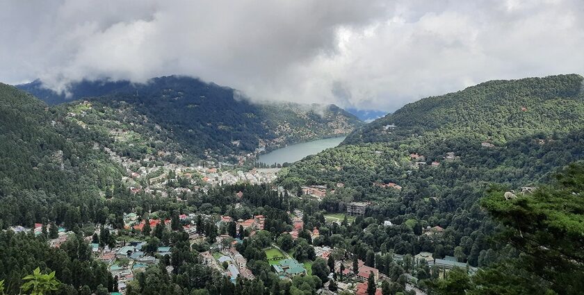 A boatman row paddles while boating in scenic Naini Lake in Nainital, Uttrakhand.