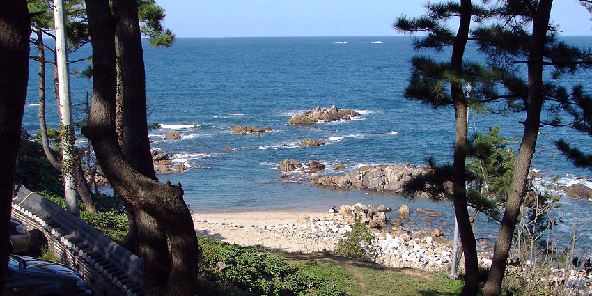 Naksan Beach offers serene landscapes, golden sands, and crystal-clear waters.