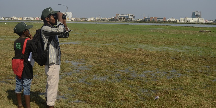 People using binoculars for spotting exotic birds at Neel Dhara Pakshi Vihar in Haridwar