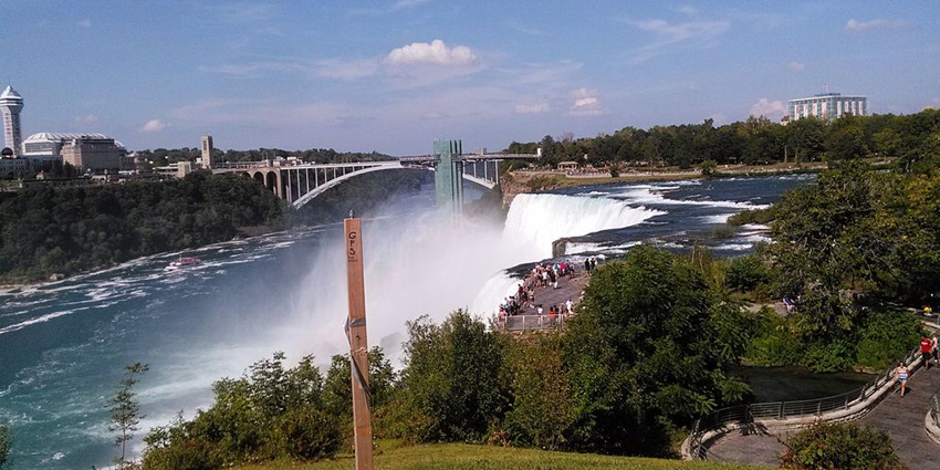 Image of Majestic waterfalls offering stunning views surrounded by building and greenery