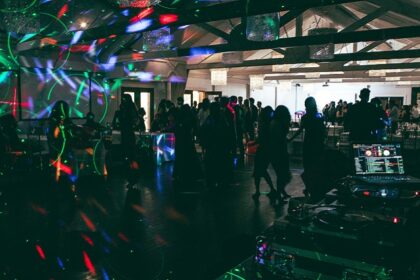 Group of people dancing and enjoying themselves at a nightclub enjoying nightlife in Canada.