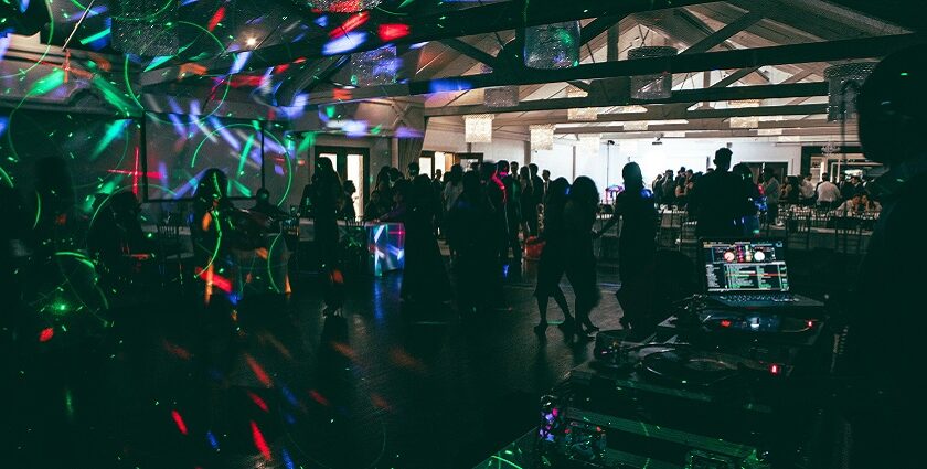 Group of people dancing and enjoying themselves at a nightclub enjoying nightlife in Canada.