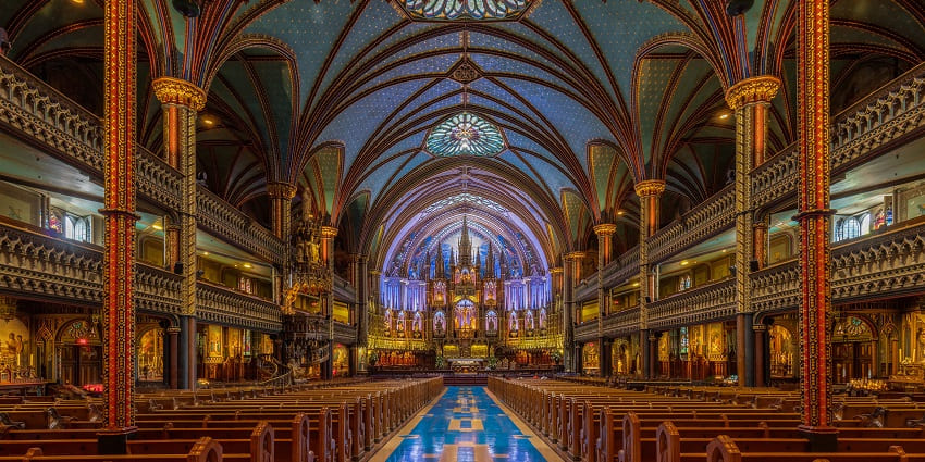 An image of Notre-Dame Basilica in Montreal, features intricate Gothic Revival architecture.