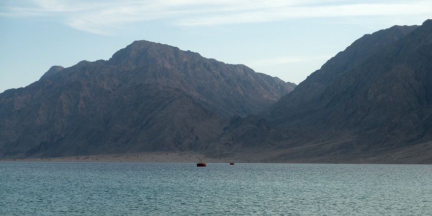 A large water body known as the Red Sea is present and across it mountains are there