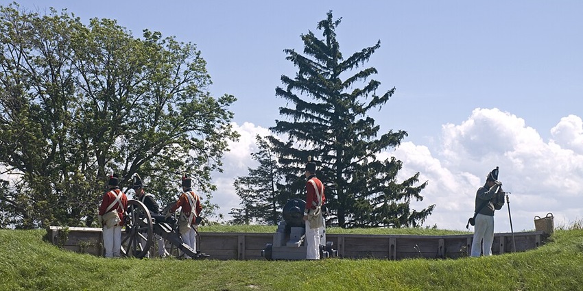 A view of a Cannon firing demonstration with smoke from a famous place.
