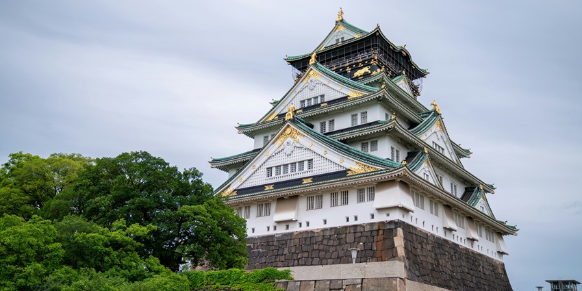 Castle surrounded by cherry blossom-filled gardens, is among the famous places to visit in Osaka